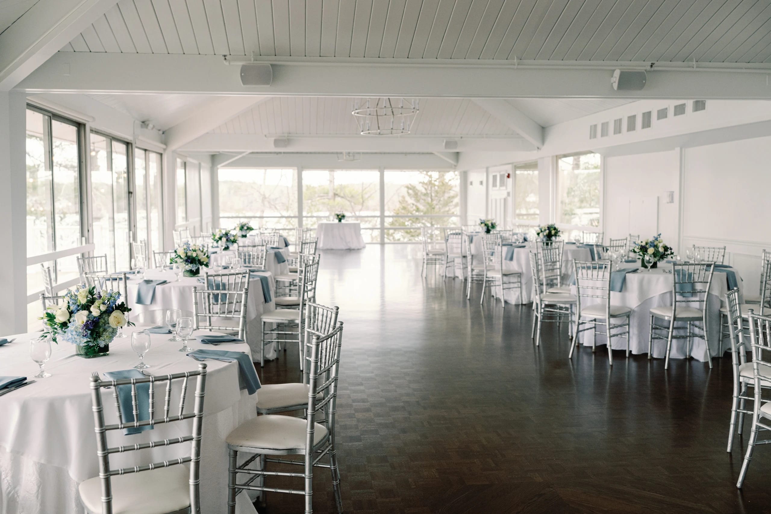 Tree Top Room reception at Lake Pearl Wrentham, bright lakeview interior with silver chiavari seating